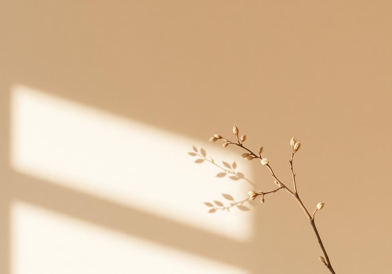 Zarter Zweig wirft Schatten auf warme Wand